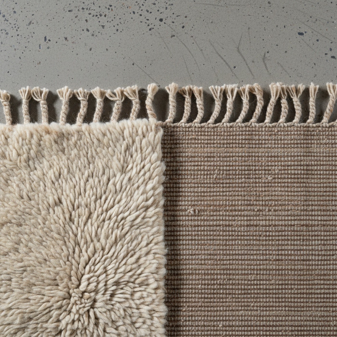 Close detail of a flat-woven wool surface showing the warp and weft
